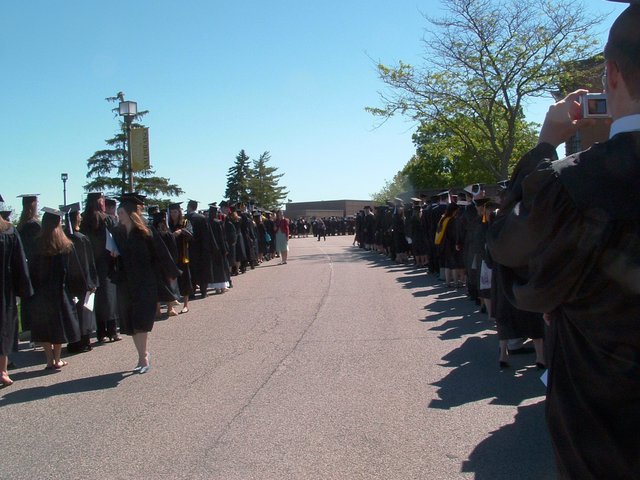Students line up along the sides of Chapel Drive in preparation to enter the Chapel of the Resurrection for baccalaureate.