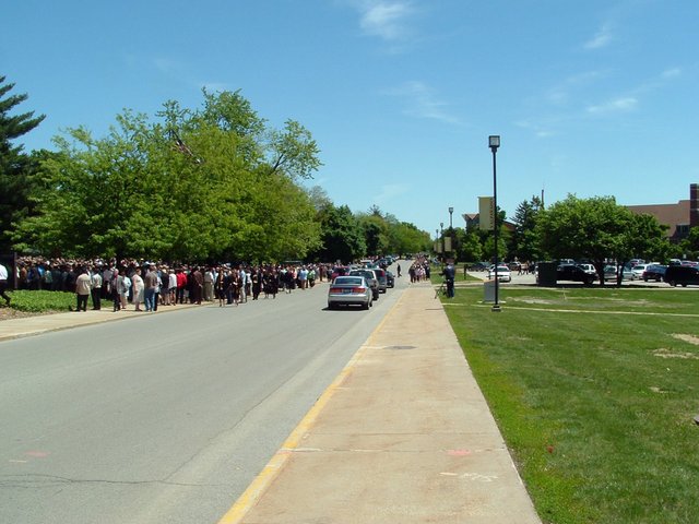 At about 12:30, people line up to get into the Athletics and Recreation Center (ARC) for commencement.  Not pictured:  The Thomas-James bunch and Sancken bunch at the front of the line.