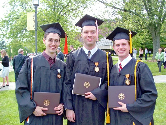 Caleb Sancken, Carl Bear, and Matthew Schaefer pose after commencement to the east of the Athletics and Recreation Center.