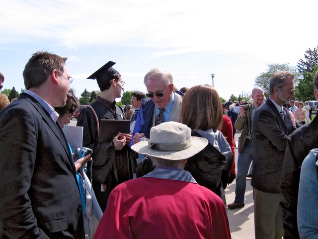 Steven Schumm, Lynne Sancken, Caleb Sancken, Virgil Sancken, Irma Sancken, and Kerin Sancken--all visible to varying degrees--converse near the Valparaiso U. Book Center following commencement. Kristin Thomas' Uncle (Marilu Thomas' older brother) is also visible. (From Gregory Sancken)
